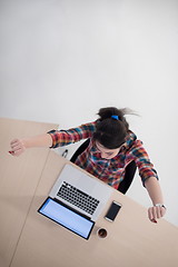 Image showing top view of young business woman working on laptop