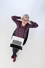 Image showing top view of young business woman working on laptop computer