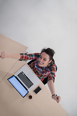 Image showing top view of young business woman working on laptop