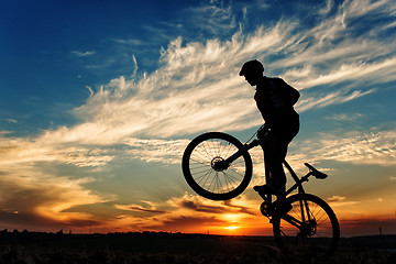 Image showing Silhouette of a man on muontain-bike