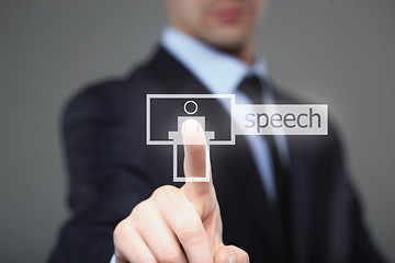 Image showing business, technology, internet and networking concept - businessman pressing speech button on virtual screens.