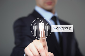 Image showing Businessman touch button interface workgroup icon