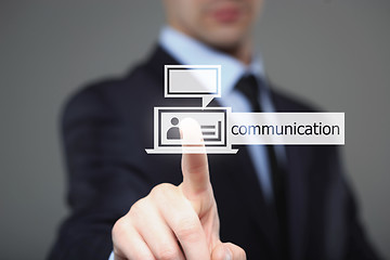 Image showing Businessman pressing communication button on a virtual background