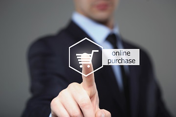 Image showing business and internet concept - businessman pressing online purchase button on virtual screens