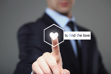 Image showing businessman pressing find love button on virtual screens