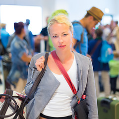 Image showing Female traveller waiting in airport terminal.