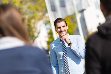 Image showing Informal out of office outdoors business meeting.