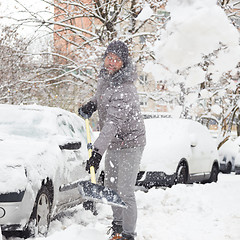 Image showing Man shoveling snow in winter.