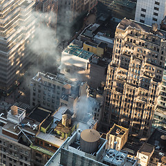 Image showing New York City, Manhattan rooftops in sunrise.