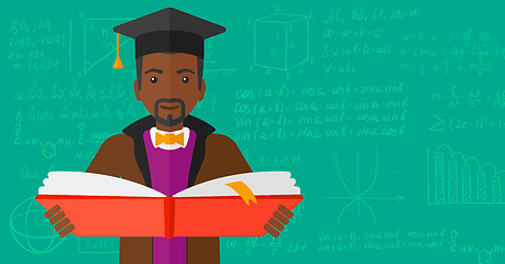 Image showing Man in graduation cap holding book.