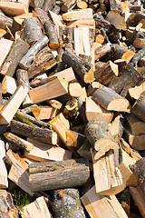 Image showing Chopped firewood on a stack.