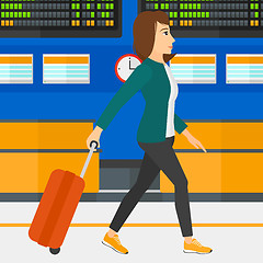 Image showing Woman walking with suitcase.
