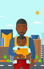 Image showing Man holding baby in sling.