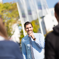 Image showing Informal out of office outdoors business meeting.