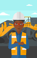 Image showing Miner with mining equipment on background.