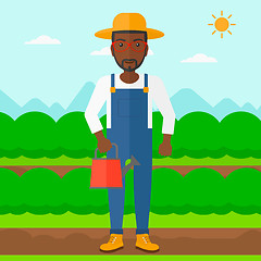 Image showing Farmer with watering can.