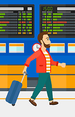 Image showing Man walking with suitcase.