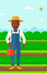 Image showing Farmer with watering can.