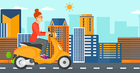 Image showing Woman riding scooter.