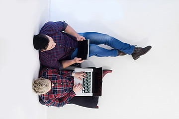 Image showing top view of  couple working on laptop computer at startup office