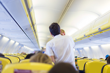 Image showing Steward on the airplane.