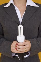 Image showing Businesswoman holding a lamp 1