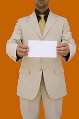 Image showing businessman holding his card