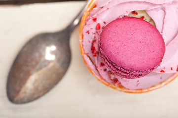 Image showing pink berry cream cupcake with macaroon on top