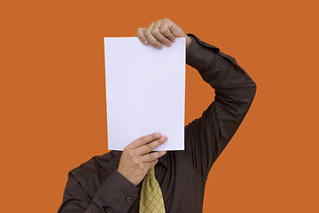Image showing Businessman holding a paper face