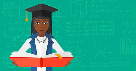 Image showing Woman in graduation cap holding book.