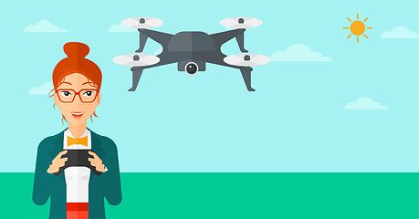 Image showing Woman flying drone.