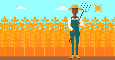 Image showing Farmer with pitchfork.