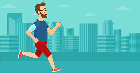 Image showing Man jogging with earphones and smartphone.