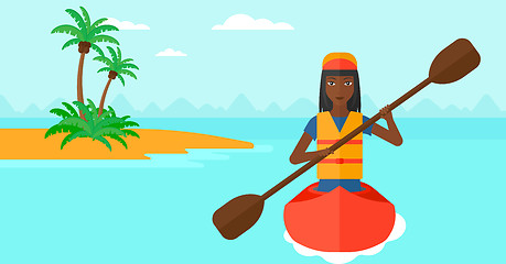 Image showing Woman riding in canoe.