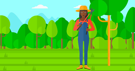 Image showing Farmer with pruner in garden.