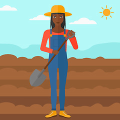 Image showing Farmer on the field with shovel.