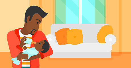 Image showing Man feeding baby.