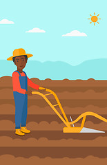 Image showing Farmer on the field with plough.