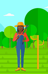 Image showing Farmer with pruner in garden.