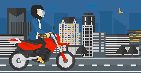 Image showing Woman riding motorcycle.