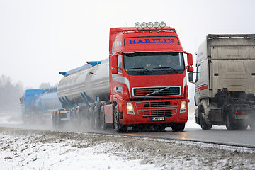 Image showing Busy Truck Traffic in Snowfall 