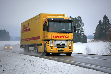 Image showing Yellow Renault Magnum Semi Truck Hauls in Winter