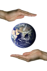 Image showing Holding the blue earth