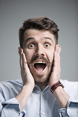 Image showing Portrait of young man with shocked facial expression