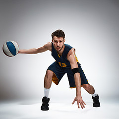 Image showing Full length portrait of a basketball player with ball 