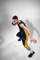 Image showing Full length portrait of a basketball player with ball 