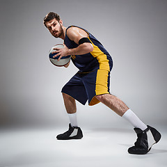 Image showing Full length portrait of a basketball player with ball 