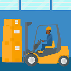 Image showing Warehouse worker moving load by forklift truck.