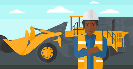 Image showing Miner with mining equipment on background.