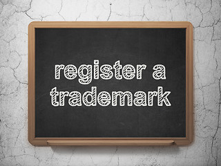 Image showing Law concept: Register A Trademark on chalkboard background